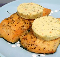 three pieces of chicken on a plate with parmesan cheese and seasoning sprinkles