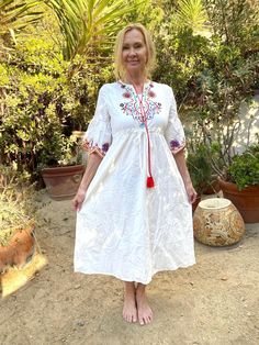 "White Embroidered cotton dress, Small, embroidered flowers, BoHo dress Beautiful with embroidered flowers High waisted, with tassels 46\" neck to bottom 36\" at bust 36\" waist, the high waist cinches to fit 44\" hips Excellent condition, unused NK351B4 White Embroidered cotton dress, Small, embroidered flowers, BoHo dress" White Peasant Embroidered Dress, White Peasant Dress With Embroidered Hem, Bohemian Cotton Embroidered Dress For Garden Party, White Embroidered Boho Dress, Traditional White Embroidered Boho Dress, Traditional White Dress With Tassels, Spring Peasant Style Embroidered Boho Dress, White Bohemian Cotton Peasant Dress, Spring Peasant Boho Dress With Floral Embroidery