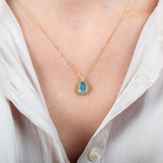 Reminiscent of a cloudless blue sky, this Aquamarine necklace adds a tiny hint of color to your outfit. We set this stone in a handmade 18k gold bezel with prongs. Technical Details Metal: 18k yellow goldAquamarine: 2.76 cts.Pendant Size (not including bail): 12.5mm x 9.5mmChain: can be worn at 16" and 18"Closure: lobster claspHandmade in New YorkStyle # N-3446-AQ Yellow Gold Teardrop Blue Topaz Necklace, Yellow Gold Teardrop Gemstone Drop Necklace, Formal Yellow Gold Aquamarine Necklace, Blue Topaz Teardrop Pendant Gemstone Necklace, Fine Jewelry Blue Topaz Teardrop Pendant Necklace, Blue Topaz Teardrop Pendant Necklace Fine Jewelry, Gold Blue Topaz Teardrop Pendant, Blue Teardrop 14k Gold Necklace, Yellow Gold Aquamarine Birthstone Necklace