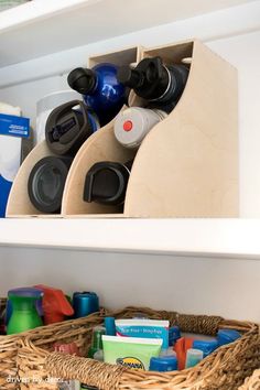 a shelf filled with lots of bottles and toys