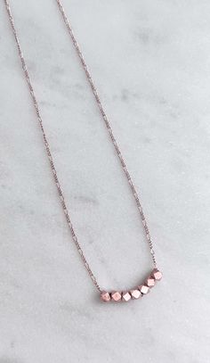 "Delicate Rose Gold Chain Necklace With Beads -------------------- DETAILS ・Extra Thin Rose Gold Plated 1.2 mm Figaro Chain ・Rose Gold Plated 3mm Faceted Beads / Not Easily Tarnished ------------------- NECKLACE LENGTH ・This necklace is available in 3 sizes. 16\" - 18\" (16\" + adjustable 2 - inch extender) 18\" - 20\" (18\" + adjustable 2 - inch extender) 20\" - 22\" (20\" + adjustable 2 - inch extender) ・It closes with lobster clasp. ------------------- JEWELRY CARE ・Plated brass items are exp Gold Beads Necklace, Rose Gold Chain Necklace, Brass Items, Dainty Choker, Rose Gold Beads, Necklace Rose Gold, Gold Bead Necklace, Rose Gold Chain, Necklace Simple