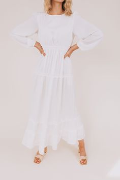 Look positively heavenly in The White: Monica! This LDS temple dress is divine, featuring a maxi length skirt with long sleeves and charming ruffle details. A comfortable elastic waistband ensures a secure fit so you can glide around like an angel. Get to floatin'! Details White dress Maxi-length Long sleeves Fully lined Pockets! High rounded neck Keyhole button closure Double elastic waistband LDS temple dress Sizing Approximate measurements: SIZE LENGTH BUST WAIST Small 55" 32" 24" Medium 55" Long Sleeve Maxi Dress For Brunch, Long Sleeve Solid Maxi Dress For Brunch, Solid Long Sleeve Maxi Dress For Brunch, Billowy Long Sleeve Maxi Dress With Ruffles, White Flowy Dress With Elastic Sleeves, White Dress With Elastic Sleeves And Flowy Fit, Flowy White Dresses With Elastic Sleeves, Flowy White Dress With Elastic Sleeves, White Billowy Dress With Elastic Sleeves