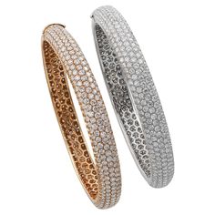 A set of two pavé-set circular-cut diamond bangles, 2 1/4 ins. diameter, mounted in 18k white and rose gold. Diamonds in a rose gold bangle weigh a total of 12.77 carats. Diamonds in a white gold bangle weigh a total of 13.21 carats. Diamonds are approximately G+ color, VS clarity. Gross weight of both bracelets is 54.8 grams. Bracelets can be sold separately. Please message direct. White Gold Bangle, Diamond Bangles, High Jewellery, Rose Gold Bangle, Gold Bangle, Diamond Bangle, Diamond Gold, Rose Gold Diamonds, High Jewelry