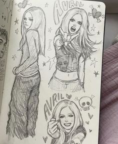 an open notebook with drawings of girls on the pages and one girl holding a cell phone