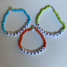 three beaded bracelets with words on them