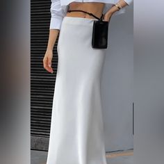 This Brand New Commense Satin Maxi Skirt Is In A Size Medium In Black And In Perfect Condition. Elegant White Mini Skirt For Evening, Elegant High-waist Mini Skirt With Relaxed Fit, White Flared Evening Skirt, White Mini Skirt For Spring Evening, White Long Skirt For Evening Wear, White Long Skirt For Evening, White Long Evening Skirt, Elegant White Lined Mini Skirt, White Lined Maxi Skirt For Evening