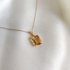 This stunning pendant is set in 14K Solid Yellow Gold with Natural Citrine with utmost precision. It is an unique gemstone pendant for nearly every occasion and is completely hassle-free jewelry. ITEM DETAILS * Gem: Citrine * Gem Size: 8X10mm * Gem Shape: Octagon * Gem Weight: 3.75 carats * Gold Purity: 14KT  * Gold Weight: 0.61 gram * Total Weight of the Pendant: 1.36 gram The Gold purity is guaranteed and it comes with authentic 14KT gold hallmark. Since my items are handmade, they are absolutely nickel and lead free. CUSTOMIZATION * Gemstone customization is available and it can be substituted with a gem of your choice. Kindly message me for the same. PACKAGING * The Pendant comes with layers of safe and secure wrapping along with Free handmade jewelry box with every purchase. ➡️Head to Luxury Yellow Gold Jewelry For May Birthstone, Topaz Jewelry Yellow, Exquisite Citrine Jewelry In Yellow Gold, Yellow Gold Citrine Jewelry, Exquisite Yellow Gold Citrine Jewelry, Octagon Shaped Citrine Jewelry In Yellow Gold, 14k Yellow Gold Gemstones For Gift, Elegant Orange Emerald Cut Jewelry, Yellow Gold Gemstones For Gift, Fine Jewelry Style