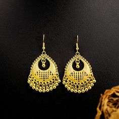 Material: Alloy Style: Ethnic Style Gold Tassel Earrings With Dangling Beads For Festival, Bohemian Metal Tassel Earrings For Party, Bohemian Gold Tassel Earrings Gift, Teardrop Tassel Jewelry, Gold Fringe Tassel Earrings For Festival, Gold Bohemian Tassel Earrings For Gift, Elegant Tassel Earrings For Festival, Festive Tassel Drop Earrings, Elegant Tassel Chandelier Earrings For Festivals