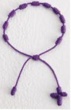 This knotted cord rosary bracelet is easy and comfortable to wear and comes in a variety of colors. Adjustable Hand Knotted Bracelets As Gift, Adjustable Hand Knotted Bracelets For Gifts, Spiritual Hand-knotted Adjustable Beaded Bracelets, Spiritual Adjustable Hand-knotted Beaded Bracelets, Adjustable Hand Knotted Spiritual Beaded Bracelets, Adjustable Hand-knotted Spiritual Beaded Bracelets, Purple Beaded Friendship Bracelet With Sliding Knot, Purple Bracelet With Sliding Knot For Beach, Purple Sliding Knot Bracelet For The Beach