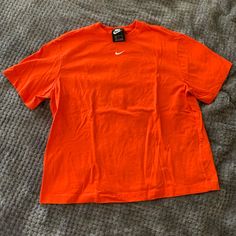 Size Small Brand New Without Tags Has Never Been Worn Excellent Condition Nike Orange Crew Neck T-shirt, Nike Casual Solid Color T-shirt, Nike Casual Solid T-shirt, Casual Solid Nike T-shirt, Casual Solid Color Nike T-shirt, Casual Nike T-shirt, Nike Basic Tops For Spring, Nike Casual Orange Tops, Casual Nike Orange Tops