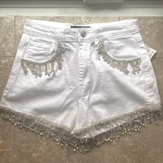 White Jean Denim Shorts With Rhinestone Fringe. New With Tags Size Small Glamorous White Summer Bottoms, Summer Party Embellished Jeans, Fitted Summer Bottoms With Rhinestone Fringe, Fitted Bottoms With Rhinestone Fringe For Summer, Embellished White Bottoms For Summer, White Embellished Bottoms For Summer, White Rhinestone Bottoms For Summer, Summer White Embellished Bottoms, Glamorous Summer Denim Bottoms