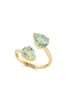 A 14-karat yellow gold bypass ring showcases pear-cut green quartz stones accented by a diamond-embellished band for luxurious sparkle. 3/8" ring face Total green quartz weight: 3.0ct. Total diamond weight: 0.06ct. Color: H–I Clarity: I1–I2 14k gold/green quartz/diamond Made in the USA Diamond Guide Bypass Ring, Diamond Guide, Green Quartz, Pear Cut, Quartz Stone, Womens Jewelry Rings, Rings Statement, Nordstrom Rack, Pear