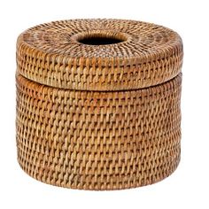 a round wicker basket with lid