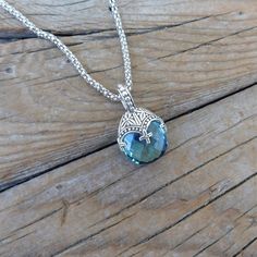 "Blue topaz necklace...1 1/4\" tall with bail by 3/4\" wide at the widest spot, cast in sterling silver 925 with a beautiful 18mm by 16mm checkerboard cut Sky blue topaz stone...the chain is 19\" with a lobster catch also in sterling silver 925...beautiful detailed necklace" Silver Blue Topaz Oval Pendant Necklace, Handmade Silver Blue Topaz Necklace, Topaz Jewelry With Large Stone For Gift, Silver Blue Topaz Pendant Necklace, Silver Oval Pendant Jewelry With Blue Topaz, Silver Topaz Pendant Necklace, Silver Oval Blue Topaz Pendant Jewelry, Silver Blue Topaz Oval Pendant Jewelry, Silver Jewelry With Blue Topaz