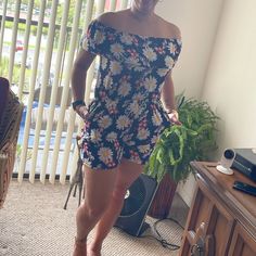 Cute, Off-The-Shoulder, Floral Romper With Pockets. Polyester Blend With Good Amount Of Stretch That Makes It Super Easy To Wear. Versatile Piece That Pairs Great With Sandals And Can Be Dressed Up Or Down. Casual Off-shoulder Jumpsuits And Rompers For Vacation, Casual Short-length Jumpsuits And Rompers For Vacation, Casual Off-shoulder Jumpsuit For Day Out, Casual Black Off-shoulder Jumpsuit/romper, Casual Black Off-shoulder Jumpsuit, Floral Romper, Super Easy, Pant Jumpsuit, Jumpsuit Romper