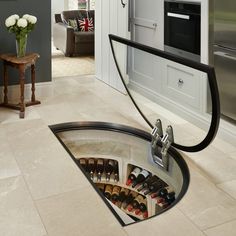 a wine rack in the middle of a kitchen floor