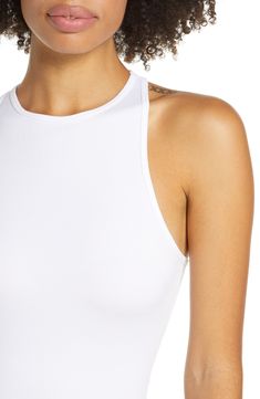 Lounge or layer in this oh-so-versatile ribbed crop top that looks (and feels) great wherever you go. 17" length (size Medium/Large) Crewneck Sleeveless Racerback 92% nylon, 8% spandex Machine wash, dry flat Imported Spring Bodycon Tank Top With Built-in Bra, Ribbed Crop Top For Summer Day Out, Summer Ribbed Crop Top For Day Out, Seamless Crop Top For Day Out, Summer Bodycon Tops With Built-in Bra, Ribbed Bodycon Tank Top, Fitted Ribbed Racerback Crop Top, Chic High Stretch Crop Top For Summer, Versatile Ribbed Crop Top Tank