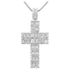 Make a bold statement of faith and elegance with our fashion statement cross pendant. This piece is crafted in 14K white gold, offering a timeless and luxurious backdrop for the dazzling array of diamonds that adorn it. The pendant features 2.59 carats of baguette diamonds, carefully set by our master artisans by hand to create a sleek and modern aesthetic. The clean lines and geometric precision of the baguette cut diamonds add a contemporary flair, reflecting light with every movement and crea Statement Of Faith, Round Diamond Pendant, Diamond Baguette, Reflecting Light, Gold Hamsa, Hamsa Pendant, Baguette Diamonds, Chain Fashion, Modern Necklaces