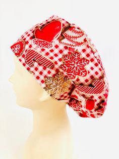 a white mannequin head wearing a red and white hat with hearts on it