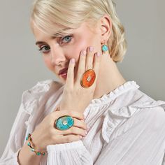 Inspired by our statement Dropping Circles earrings, we designed the Tini Mini Drops to be worn with all your everyday looks. Each semi-precious gemstone sits next to a small cubic zirconia cabochon for a subtle pop of sparkle. Add them to any outfit for colorful fun! Details Lightweight drop earrings Made of genuine blue mohave turquoise and cubic zirconia stone Skillfully crafted in 14k gold plated recycled brass Nickel free and hypoallergenic Dimensions: 5/8" Wide x 1 1/8" Long Please note th Modern Enamel Jewelry With Gemstone, Elegant Turquoise Enamel Earrings, Fine Jewelry Turquoise Gemstone, Turquoise Gemstone Fine Jewelry, Modern Oval Turquoise Jewelry, Modern Turquoise Oval Jewelry, Modern Turquoise Round Jewelry, Modern Round Turquoise Jewelry, Elegant Enamel Jewelry With Gemstone