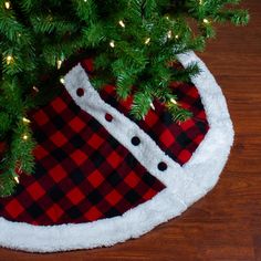 a red and black plaid christmas tree skirt