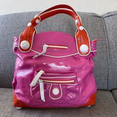 George Gina And Lucy Rare Pink/Orange Patent Leather Large Hobo Handbag Pre-Owned: In Excellent Condition. Normal Signs Of Wears. Please Refers To Pictures. Height: 13 Inches Width: 18 Inches Depth: 5 Inches Questions? Leave A Comment Below! George Gina And Lucy, Hobo Handbag, Hobo Handbags, Pink Orange, Pink And Orange, Patent Leather, Bag Lady, My Style, Handbags