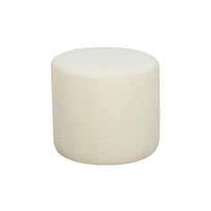 a white round ottoman sitting on top of a white floor