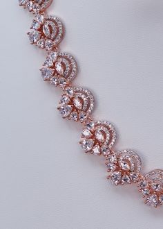 This necklace set features a beautiful circular floral pattern that makes it a perfect accessory for the festive season. Pair it with the perfect wedding ceremony dress or an ethnic piece specially made for big occasions! Neckline Length: 9.5" and The length of the necklace is adjustable by a chain. Earrings Length: Approx. 1.5" Rose Gold finish on high-quality brass as the base metal Availability: In-Stock *Color may vary slightly due to light condition & photography. Jewelry Care: Keep away fr Wedding Ceremony Dress, Ceremony Dress, Photography Jewelry, Phone Items, Ceremony Dresses, Zirconia Necklace, Cubic Zirconia Necklace, The Perfect Wedding, Chain Earrings