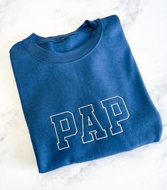 Celebrate your dad as a new Grandpa with this adorable sweatshirt.  He can be proud of his new title and show it off.   LEAD TIME + SHIPPING  Please be aware that due to supply delays, some products may be suddenly unavailable or have longer turnaround times.  Customer is responsible for any address changes.  Once carrier scans the package, it is no longer the responsibility of Foxblossom. Each order is custom made and will take approximately 3-7 business days to be created.  All smaller and reg Father's Day Cotton Crew Neck Sweatshirt, Father's Day Casual Sweatshirt With Name Print, Father's Day Cotton Sweatshirt With Name Print, Family Matching Crew Neck Sweatshirt For Father's Day, Family Cotton Sweatshirt With Letter Print, Cotton Sweatshirt With Name Print For Family, Family Cotton Crew Neck Sweatshirt, Cotton Sweatshirt For Fall, Casual Blue Sweatshirt With Name Print