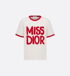 The T-shirt features the red Miss Dior Graffiti motif, a nod to the 1967 debut ready-to-wear collection and a manifesto to Maria Grazia Chiuri's signature celebration of feminism. Crafted in white cotton and linen jersey, the classic crew-neck design is enhanced by contrasting trim. The T-shirt will complete a variety of outfits in any season and can be paired with other Miss Dior Graffiti creations.. XS Dior Tshirt, Dior Clothes, Denim Swimsuit, Designer Wardrobe, Dior Shirt, Dior Star, Dior Collection, Dior Book Tote, Maria Grazia Chiuri