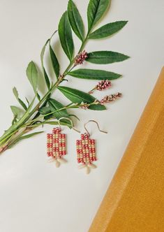 Matte rose and tan seed beads handwoven in a classic checkerboard pattern. Hung on a sterling silver ear hook. Handwoven Brown Jewelry As A Gift, Natural Color Woven Jewelry Gift, Natural Woven Jewelry Gift, Natural Woven Jewelry As Gift, Natural Woven Jewelry For Gifts, Brown Woven Jewelry As Gift, Woven Red Jewelry For Summer, Red Woven Jewelry For Summer, Artisan Handwoven Rectangular Jewelry