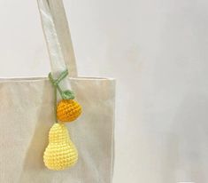 a crocheted bag hanging from a hook