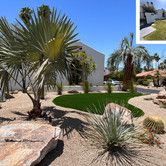 this is an image of a desert landscape with palm trees and rocks in the foreground