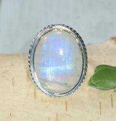 "Natural Premium Grade Oval Moonstone .925 Sterling Silver Ring Size 6.5 7 Grams 7/8\" x 3/4\" CN09. Much more blue flash than picture shows! This is a handpicked natural stone, the exact one shown in picture. The sterling silver is .925 and stamped. Each piece is hand made by artisans in my shop. The quality of the stones and the silver workmanship is impressive. Please look at other items in my store. I sell ready made jewelry with hand crafted silver work, pendants with a sterling silver bail Collectible Oval Cabochon Moonstone Ring, Untreated Oval Silver Moonstone Ring, Moonstone Ring Sterling Silver, Rainbow Moonstone Ring, Made Jewelry, Silver Work, Moonstone Ring, Boho Rings, Ready Made