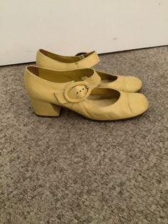 This nice pair of 60s Chandlers yellow leather Mary Jane buckle shoes comes to you in a cool Mod style in a size 6.5-7.5. As you can see from the pictures of the heels-gently worn n loved. Pls compare the measurements to those in your closet. 60s Mary Janes, Retro High Heel Mary Janes With Buckle, Retro High Heel Mary Janes With Buckle Closure, Retro High Heel Mary Janes In Medium Width, Retro High Heel Mary Janes Medium Width, 60s Shoes Women, Retro Mary Janes With Heel Strap And Closed Toe, Retro Closed Toe Heels With Buckle, Retro Closed Toe Mary Janes For Summer