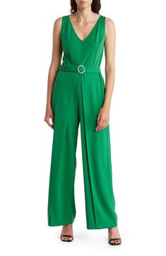 Set the trend in this sleeveless crepe jumpsuit featuring an attached belt with a sparkling buckle and elegant leg overlays. V-neck Sleeveless Unlined 96% polyester, 4% spandex Hand wash, line dry Made in the USA Model stats: 5'10" height, 32" bust, 25" waist, 36" hip. Model is wearing size Small. Sleeveless Belted Jumpsuit For Party, Elegant Spring Jumpsuits And Rompers With Belt Loops, Belted Strapless Jumpsuit For Workwear, Elegant Green Strapless Jumpsuit, Belted Strapless Sleeveless Jumpsuit, Belted Strapless Jumpsuit, Chic Belted Strapless Jumpsuit For Work, Fitted Sleeveless Jumpsuit With Belt Loops, Sleeveless Belted Formal Jumpsuit