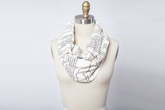 Name of the Wind Infinity Scarf – Worldbuilders Market The Name Of The Wind, Book Scarf, Jersey Knit Fabric, Infinity Scarf, American Made, The Edge, The Wind, Knit Jersey, Knitted Fabric