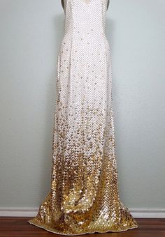 "This is an absolutely breathtaking gown. It's fully embellished with bright white and gold sequins and accented with tiny gold beading between each and every sequin. The straps are also embellished with gold glass beading. It's in excellent condition! Measurements: Bust - 32-36\" Waist - 26-30\" Hips - 36-40\" Total Length - 61\" This dress comes from a pet-free and smoke-free home. If you would like more info or have any questions, please don't hesitate to ask!" Gold Sequin Dress With Contrast Detail For Wedding, Gold Sequined Gown For Prom, Gold Floor-length Sequin Dress For Prom Season, Gold Floor-length Sequin Dress For Prom, Glamorous Gold Sequin Fabric For Prom Season, Gold Sequined Evening Gown, Gold Sequin Fabric For Prom Season, Gold Sequin Gown For Evening, Gold Sparkling Gown For Prom Season