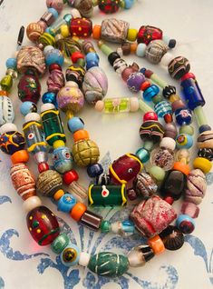 "You will receive: Fun Artisan handcrafted Global colorful glass / clay beads & Lots of cute spacer beads. Randomly Size From : 3-30mm Approximately hole: 1-3mm Random shapes and colors as seen on picture Strand 14\" Approx **Please note that these are Handmade Rustic beads, shapes are not close to perfect, and that is the beauty of it** So if you're looking for perfect shape & smooth Texture these beads will not be for you you'll love them! Contact me if you need larger quantity." Multicolor Recycled Glass Bead Jewelry, Multicolor Recycled Glass Beaded Jewelry, Bohemian Czech Glass Oval Beads, Bohemian Czech Glass Tiny Beads, Bohemian Oval Czech Glass Beads, Colorful Bohemian Spacer Beads, Bohemian Colorful Spacer Beads, Bohemian Czech Glass Beads With Large Beads, Bohemian Czech Glass Spacer Beads