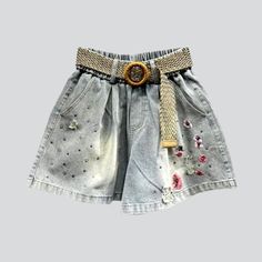 Unveil the vintage glamour of our 2023 Summer Collection the y2k women's loose denim shorts! These high-waisted shorts offer a timeless blend of nostalgia and modern style. with its unique embellishments. sanded finish. and intricate zipper & button closure.Why You'll Fall In LoveThese shorts capture the spirit of the millennium's iconic fashion scene. with its vibrant rhinestones. loose silhouette. and painted print. Every detail promises to transform your look into a timeless masterpiece.Unmis Trendy Short Denim Skirt For Summer, Vintage Denim Blue Bottoms For Summer, Vintage High Waist Denim Skirt For Summer, Rhinestone Denim Shorts, Loose Denim Shorts, Rhinestone Denim, Graceful Movement, Retro Glamour, Iconic Fashion