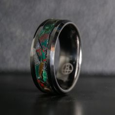 a wedding ring with an artistic design on the inside and inlayed to it