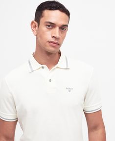 This lightweight polo shirt features classic details and offers a tailored fit. The Barbour Newbridge polo shirt has a pointed tipped collar and a two button placket with embroidery to the chest for a branded finish. Mens Tailor, Care Logo, Padded Jacket, Light Jacket, Bold Fashion, Polo Shirts, Button Placket, Sport Outfits, 12 Months