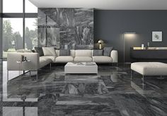 a modern living room with marble flooring and walls in black and white colors is pictured