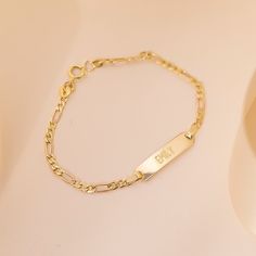 If you're looking for a creative and special gift for toddlers and children, this beautiful, engravable plain rectangular identification tag bracelet is a meaningful gift for any event. Entirely crafted in 14k Yellow Gold, which is safe for babies and children's everyday wear. Order a traditional ID bracelet today and we'll neatly package it into its own lovely gift box. Personalized Yellow Gold Rectangular Name Bracelet, Personalized Rectangular Yellow Gold Name Bracelet, Elegant Hypoallergenic Nameplate Bracelet, Classic Rectangular Name Bracelet, Tarnish Resistant, Classic Tarnish Resistant Name Bracelet, Personalized Rectangular Bracelets As Gifts, Elegant Rectangular Bracelets With Name Detail, Elegant Name Bracelets With Rectangular Shape, Classic Personalized Rectangular Bracelets