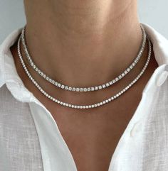 This stunning diamond tennis necklace is the perfect addition to your jewelry collection. It is classic and timeless and always in style! Based on a 16" chain length. We can custom make the length or carat weight too. Please email info@lolajamesjewelry.com to do so. 14K Gold Natural Diamonds 3.8ct: 203 round diamonds, 8.96 grams 5ct: 172 round diamonds, 11.65 grams 8ct: 147 round diamonds, 11.65grams J color, SI clarity 4 prong setting FINAL SALE Diamond Jewerly, Tennis Jewelry, Diamond Bracelet Design, Diamond Tennis Necklace, White Gold Chains, Luxury Necklace, Jewelry Fashion Trends, Stacked Jewelry, Jewelry Lookbook