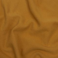 an orange colored fabric textured with some sort of clothing material that is very soft