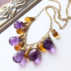 "6970 Amethyst Citrine Necklace Gold Filled wire wrapped natural purple yellow gemstone beaded fringe bohemian statement choker anniversary holiday gift for her women mom sister wife girlfriend niece aunt grandma cousin best friend colleague. Enjoy the beauty & power of natural gemstones! THIS LISTING IS FOR THE NECKLACE ONLY Earrings shown for illustration and listed separately; MATERIALS & DIMENSIONS ✦ Natural AMETHYST, vivid purple, faceted teardrops approx. 13x8|11x7mm; ✦ Natural CITRINE, ye Artisan Amethyst Gemstone Beads Jewelry, Artisan Wire Wrapped Dangle Necklace, Yellow Teardrop Bohemian Jewelry, Bohemian Gold Dangle Crystal Necklaces, Bohemian Wire Wrapped Teardrop Jewelry, Bohemian Teardrop Wire Wrapped Jewelry, Amber Spiritual Dangle Jewelry, Purple Bohemian Necklaces For Healing, Bohemian Purple Necklaces For Healing