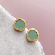 A stunning & minimal pair of mint & gold circle stud geometric earrings These simple and versatile everyday earrings are available in a rainbow of colours including pink, olive, lilac, berry, teal, dark green, burnt orange and cream  These stud earrings also come in a silver plated colour way  DETAILS These geometric earrings measure 1.5cm Surgical ear posts which are nickel free & hypoallergenic All my jewellery is made from high quality digitally printed FSC certified 3mm plywood, which is cut Modern Green Earrings, Everyday Green Circular Earrings, Elegant Green Circular Earrings, Green Everyday Earrings, Modern Green Circular Jewelry, Modern Green Earrings As Gift, Modern Green Drop Earrings, Modern Green Round Earrings, Modern Green Hoop Earrings As Gift