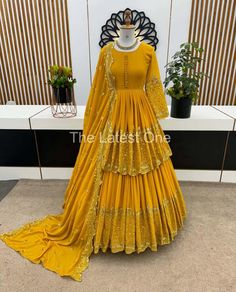 🧵Fabric Detail 🧵 💃Top💃 Top Fabrics         : Faux Georgette With Heavy 5mm Embroidery Sequence Work With  Sleeves   Top Flair         :   2.5 Meter  Top Inner        : Heavy Micro Cotton  Top Length     : 35 Inch Top Size.         :S (36) M(38) L(40) XL (42)* 💃 Lehenga💃 Lehenga Fabric :Faux Georgette With Heavy 5mm Embroidery Sequence Work  (Fully stitched) Lehenga Inner       :Heavy Micro Cotton  Lehenga Flair     : 4 Meter 💃Dupatta 💃 Dupatta Fabrics : Faux Georgette With Embroidery Sequence Work and Embroidery Sequence lace Border Dupatta Length: 2.10 mtr ⚖ Weight  : 950 gm Yellow Colour Outfits, Fitted Gold Gown With Dabka Work, Gold Fitted Georgette Dress, Party Wear Sharara In Chinon, Floor-length Embroidered Party Sets, Floor-length Chinon Sets For Diwali, Floor-length Chinon Set For Wedding, Gold Floor-length Sets With Dabka Work, Fitted Gown With Dabka Work In Chinon