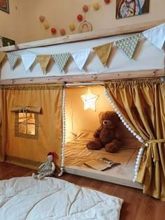 a teddy bear is sitting in the corner of a small bed with curtains on it